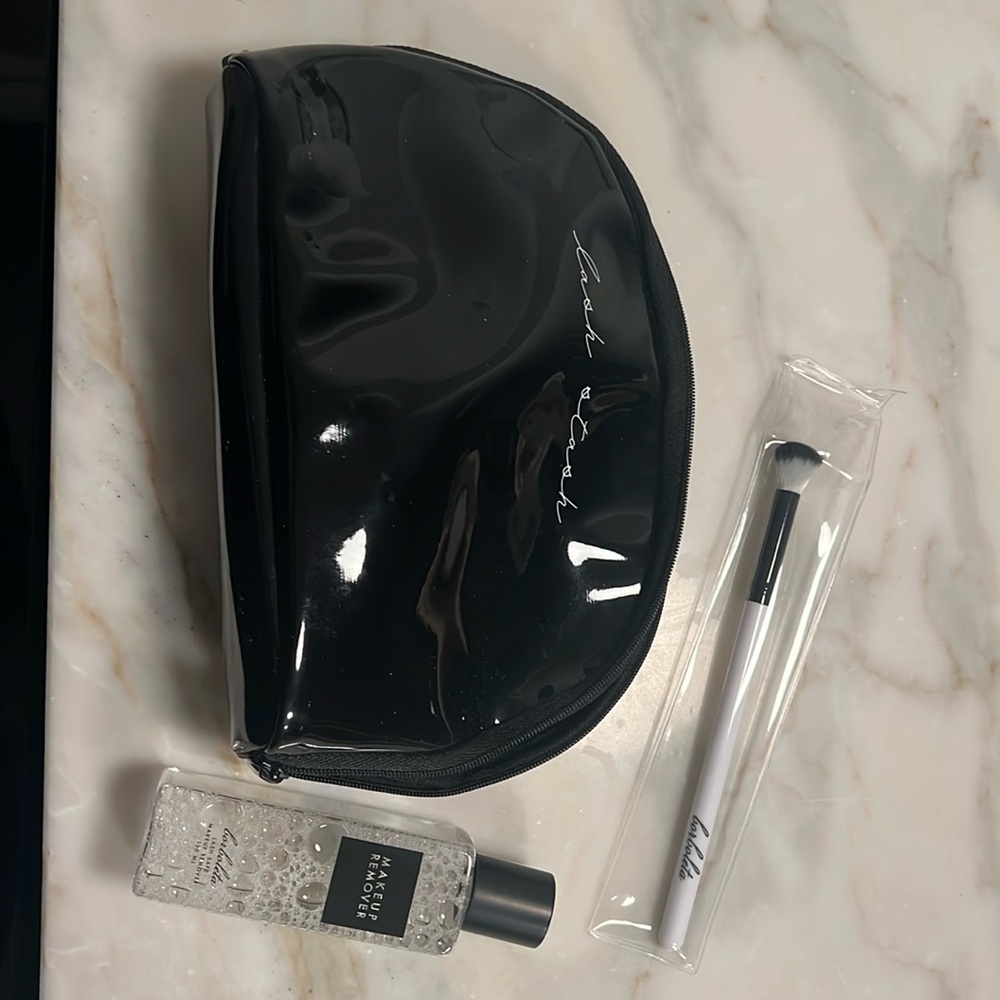 NEW NEVER OPENED OR USED LASH STASH BAG WITH MAKEUP REMOVER AND MAKE UP BRUSH